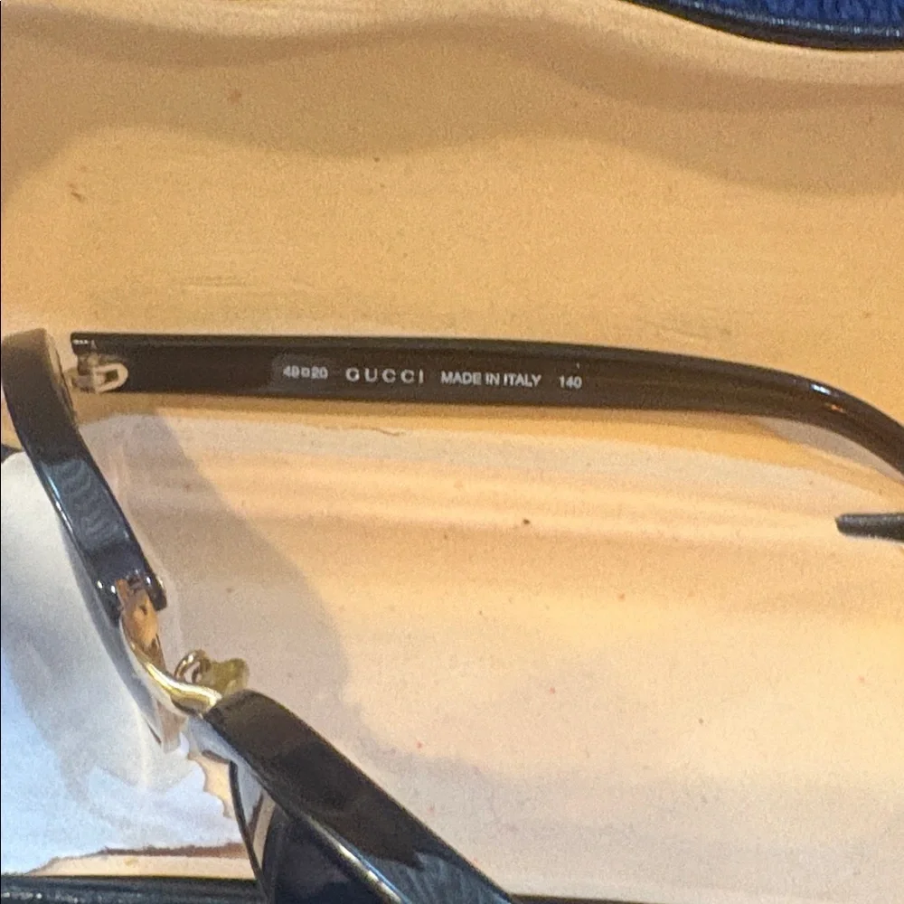 GUCCI Black and Gold Sunglasses with Case and wipe.